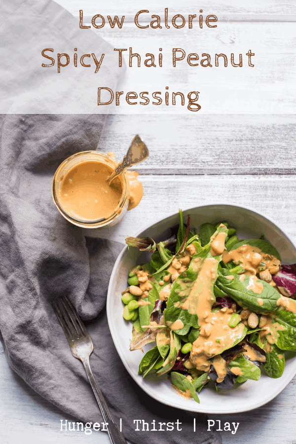 overhead photo of thai peanut dressing and a salad dressed