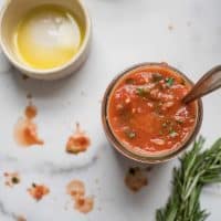 overhead view of pizza sauce ingredients.