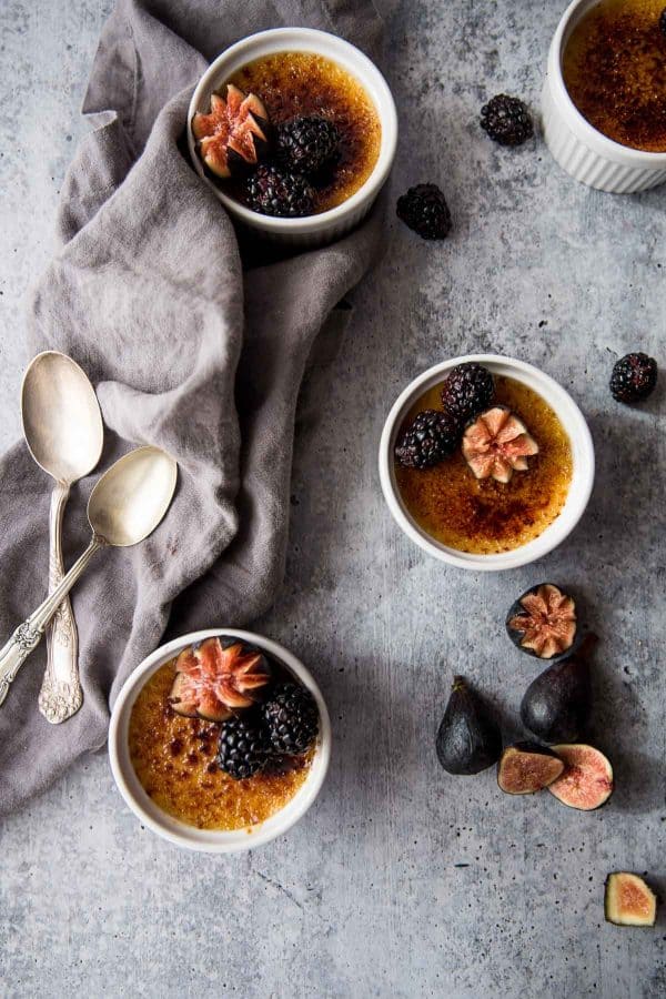 creme brulee with grand marnier garnished with fresh figs and blackberries
