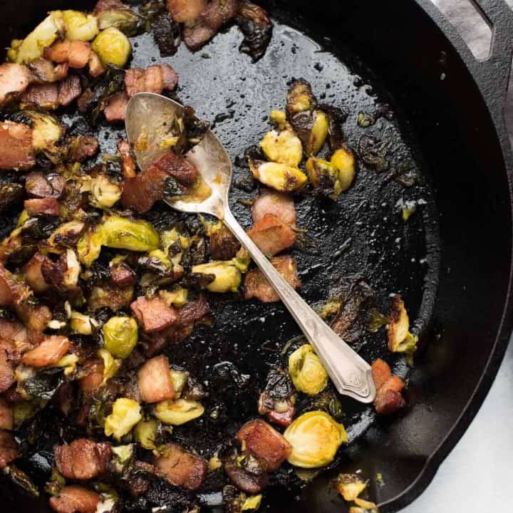 overhead view of cast iron pork belly brussels sprouts