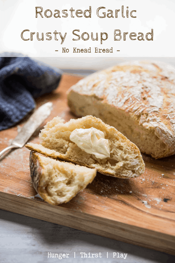 buttered pieces of fresh crusty no-knead bread