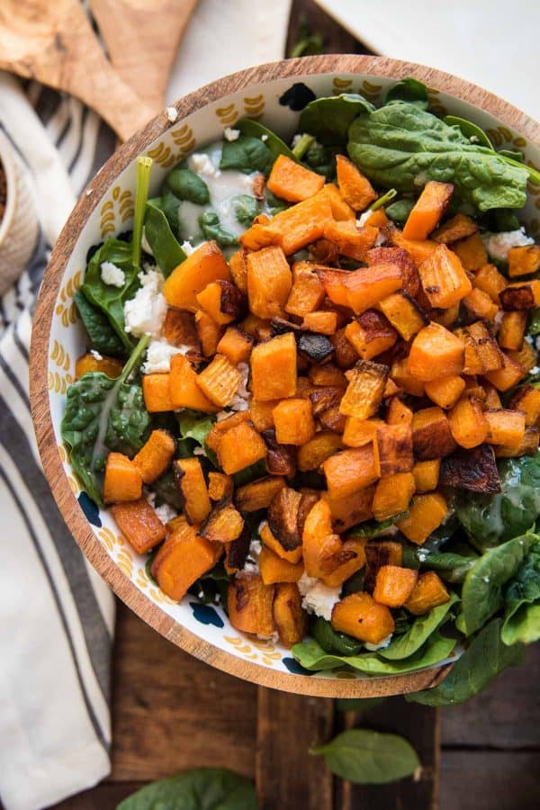 hot roasted butternut squash melts goat cheese and warms spinach in a bowl