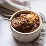 scooping some chocolate oats with peanut butter