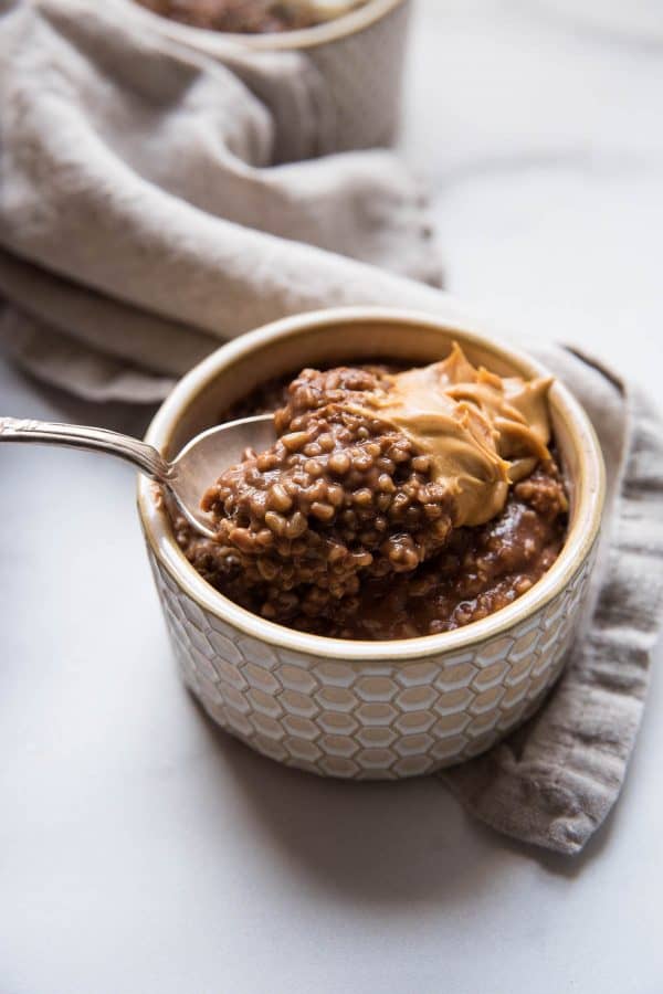 scooping some chocolate oats with peanut butter