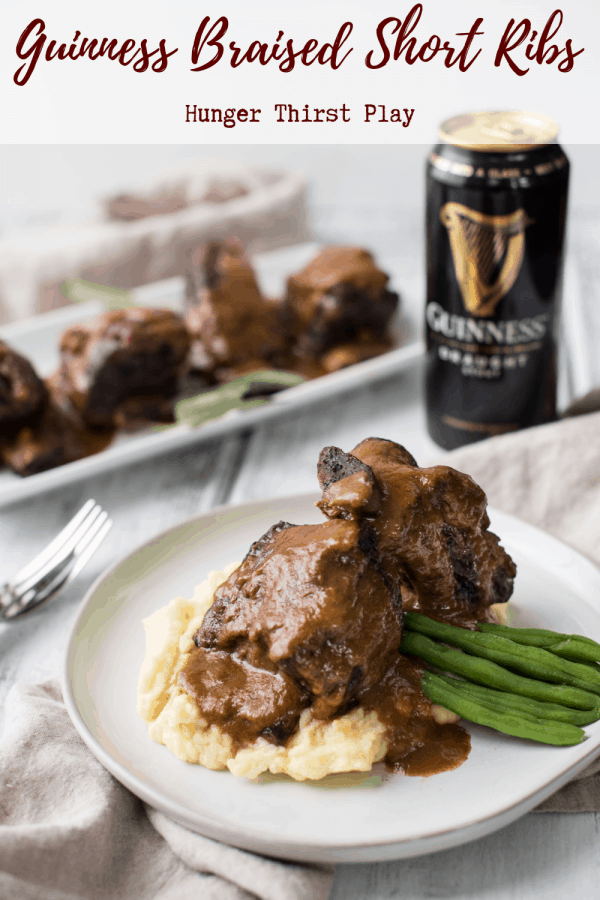 plated pieces of guinness braised short ribs over creamy mashed potatoes