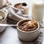 spoon resting in a bowl of chocolate steel cut oats