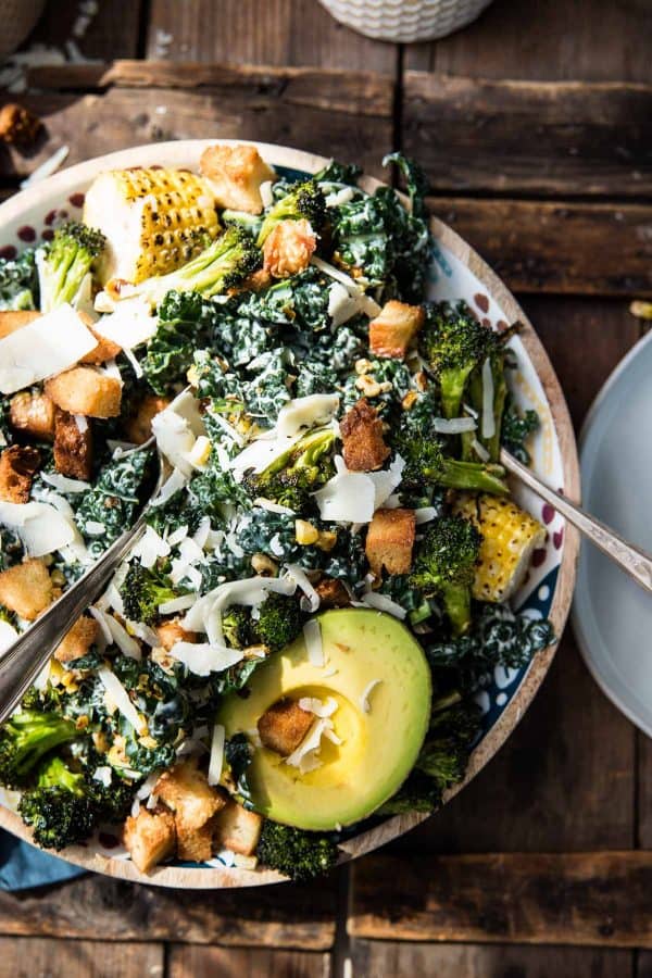 Bowl of roasted broccoli and kale caesar salad