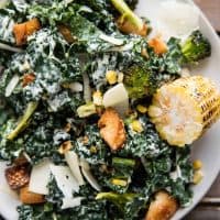 roasted broccoli and kale caesar salad on a plate