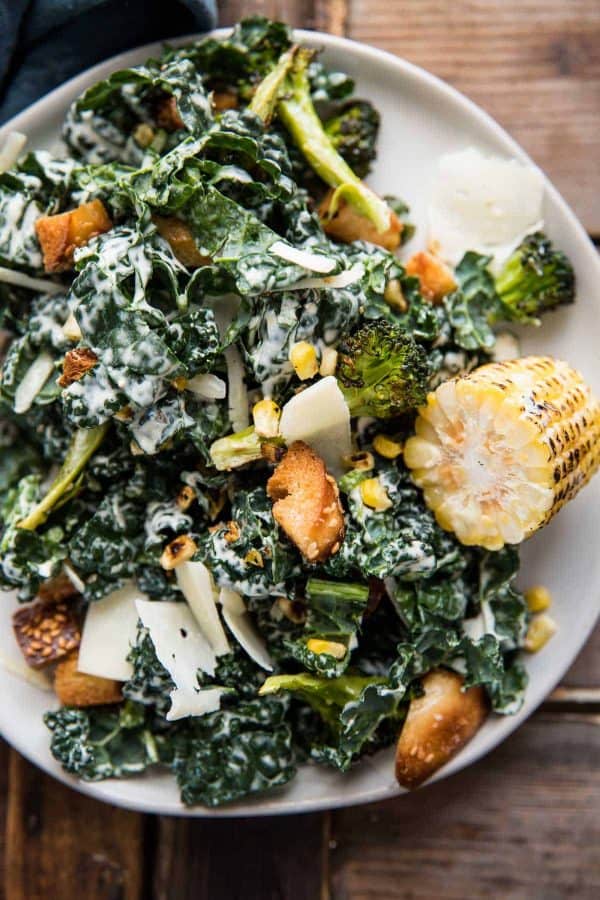 roasted broccoli and kale caesar salad on a plate