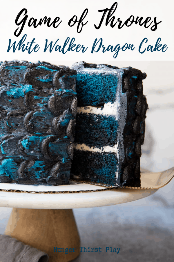 pulling a slice out of game of thrones themed white walker dragon cake