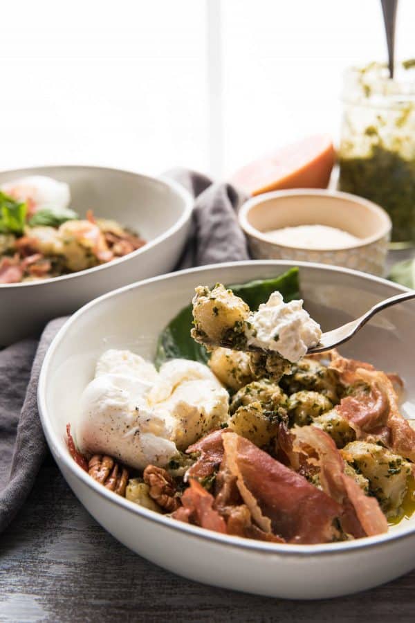 gnocchi and pesto with burrata on a fork