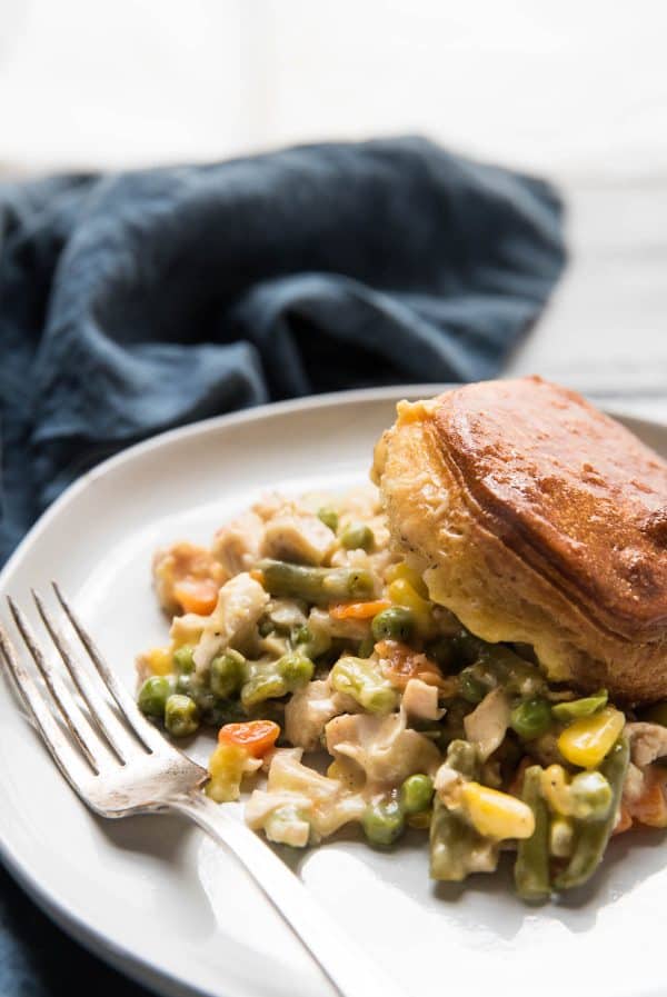 close up of chicken pot pie with biscuits on a plate