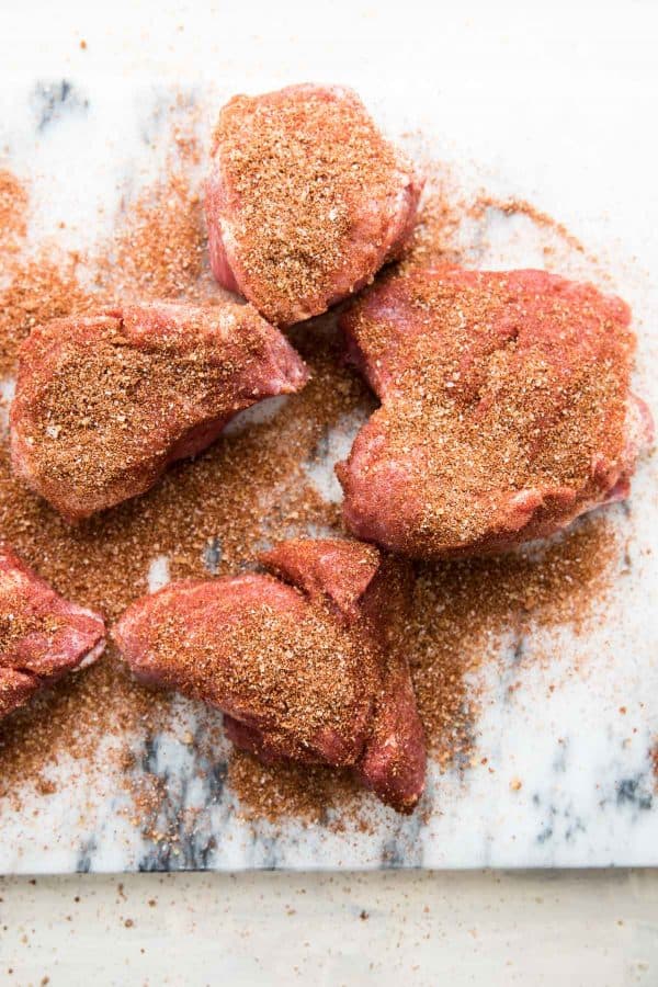 large pieces of pork shoulder seasoned with spices