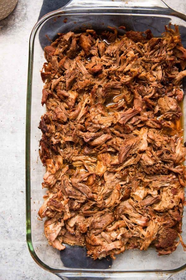 overhead view of pork carnitas pulled and broiled