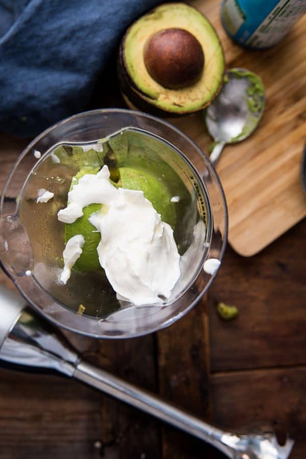 overhead of all the jalapeno avocado crema ingredients ready to be blended