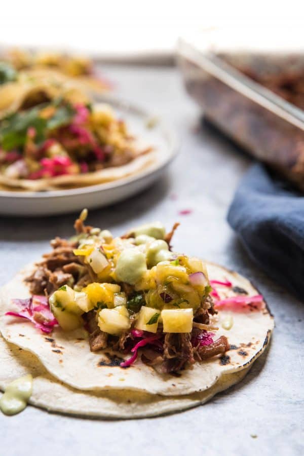 carnitas taco toppings piled high