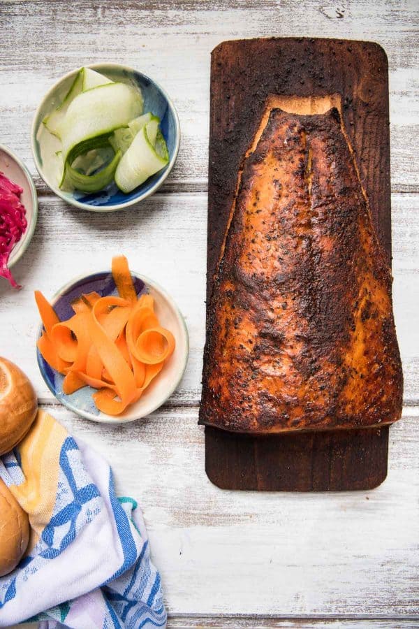 overhead view of cedar plank salmon and garnishes