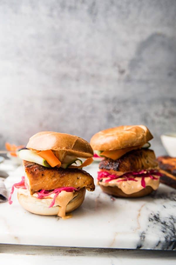 layers of salmon sliders on mini bagels