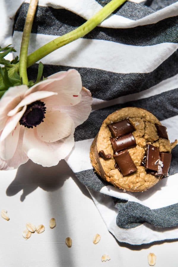 peanut butter banana muffin with chocolate chunks on a striped napkin