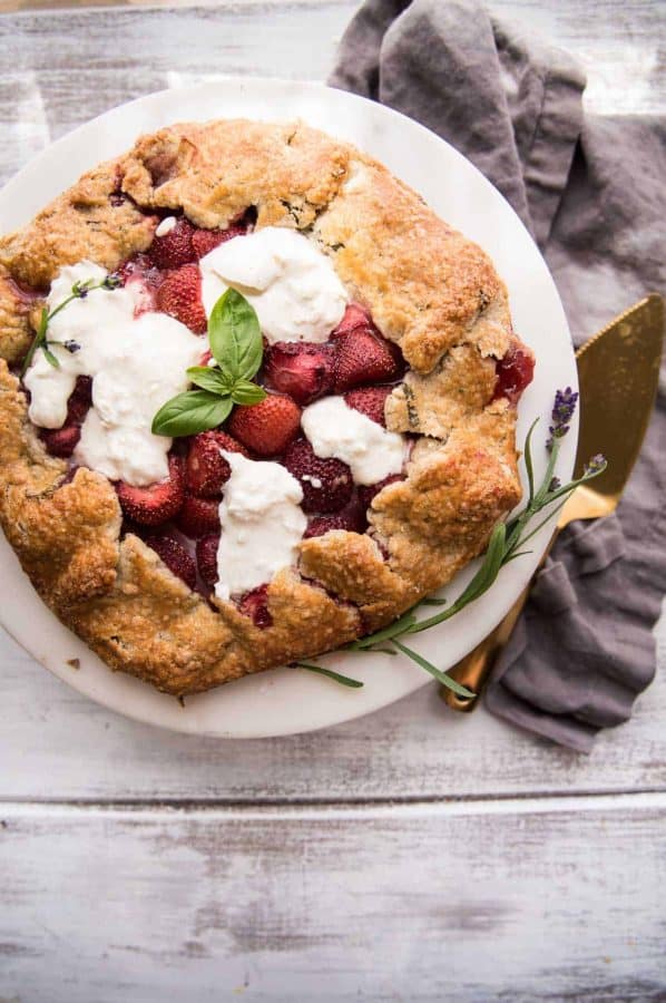 strawberry galette with melty burrata on a serving tray