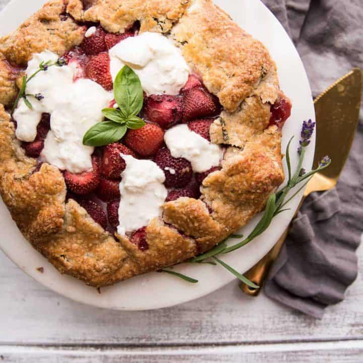 strawberry galette with melty burrata on a serving tray