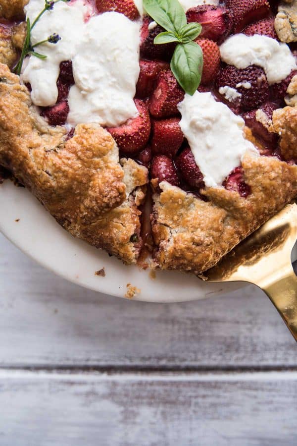 serving the first slice of strawberry burrata galette