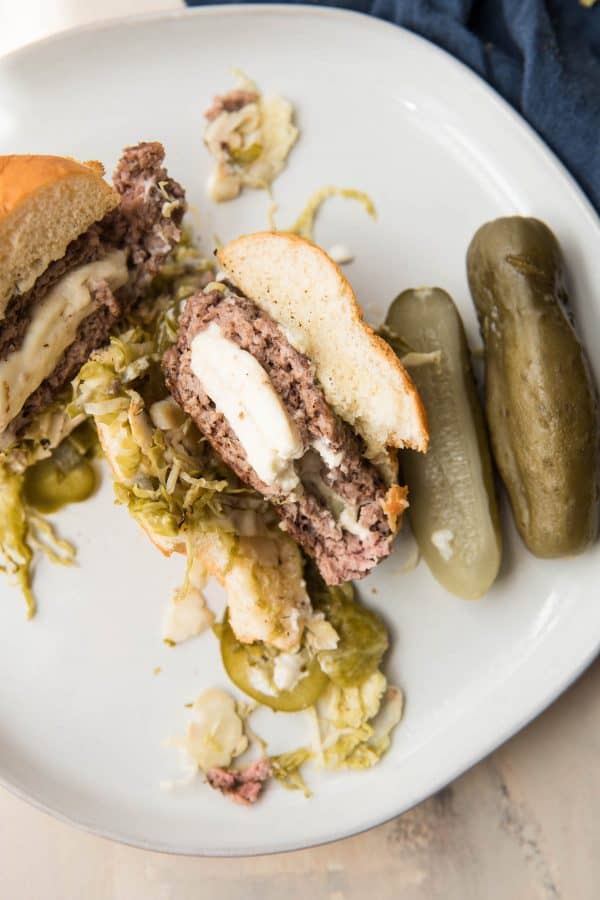 feta stuffed burger cut in half