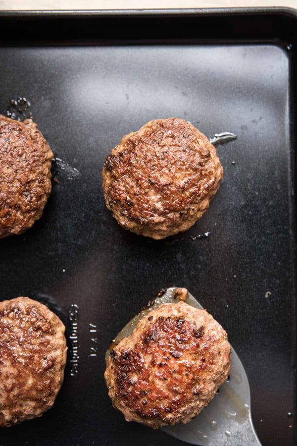 lamb burgers on a sheet tray