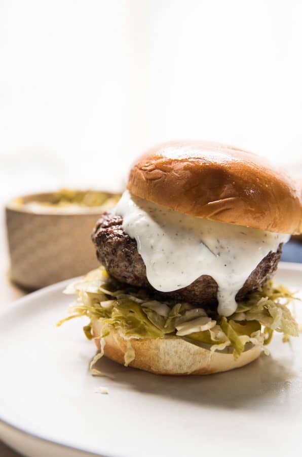 creamy tzatziki on ground lamb burger