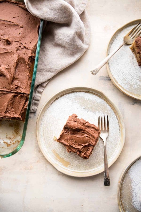 slice of peanut butter cake on a plate with antique fork