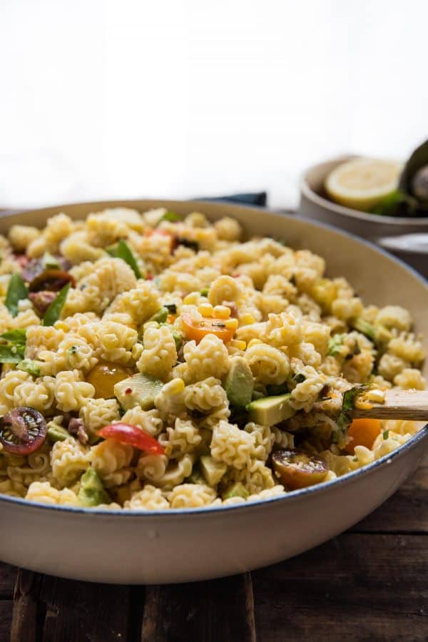 side view of big bowl of summer pasta salad