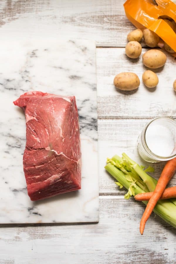 top round cut of beef being prepared for pot roast