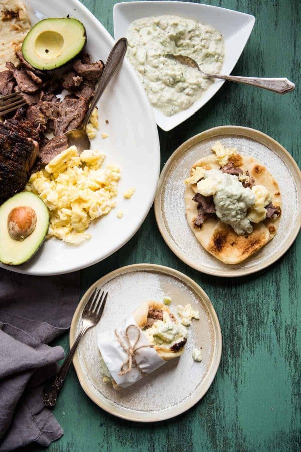 overhead view of a platter of ingredients and ready made breakfast lamb gyros