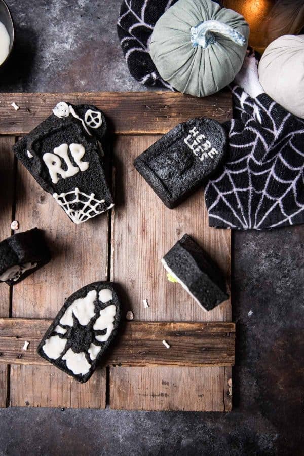 overhead shot of tombstone cakelets decorated for halloween