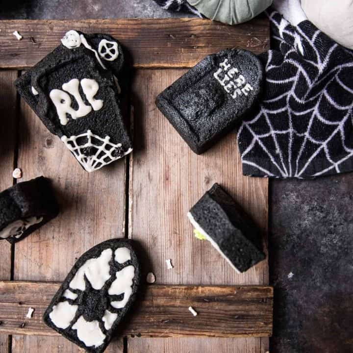 overhead shot of tombstone cakelets decorated for halloween