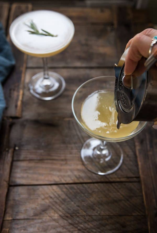 pour cocktail into a coupe glass