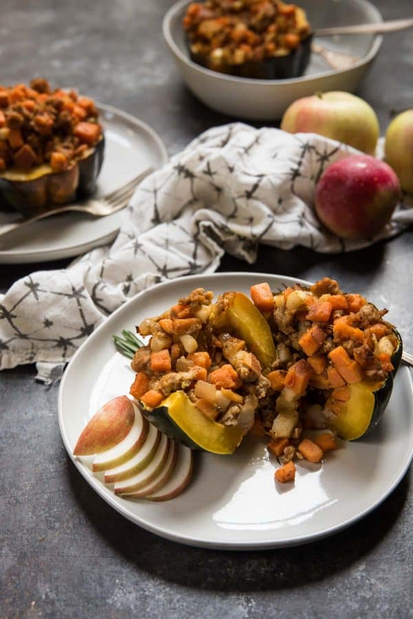 sliced squash stuffed with sweet potatoes and chicken sausage