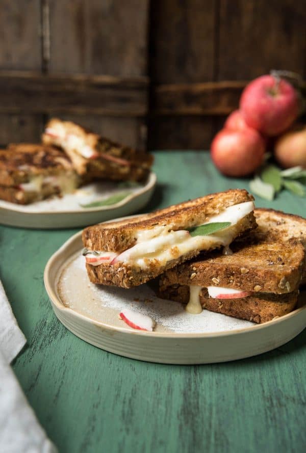 slices of apple and brie grilled cheese stacked on each other