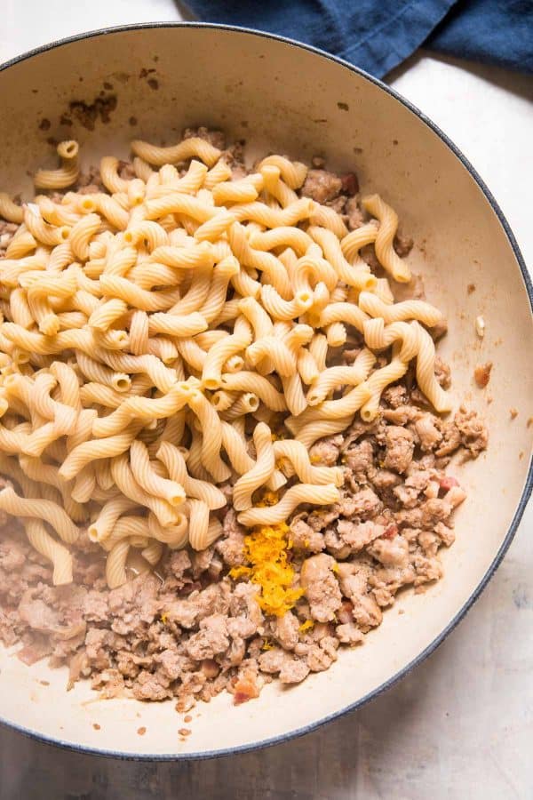 fresh cooked chickpea pasta poured into a skillet