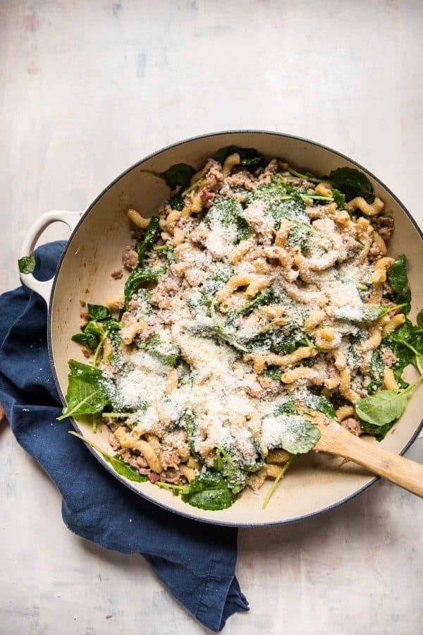 cavatappi sprinkled with parmesan and baby kale