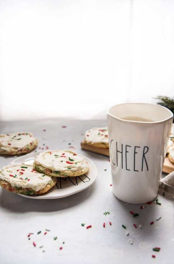 cookies for santa on a plate with a cup of milk