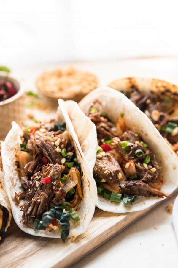 tortillas stuffed with pressure cooker korean beef, kimchi and crushed peanuts