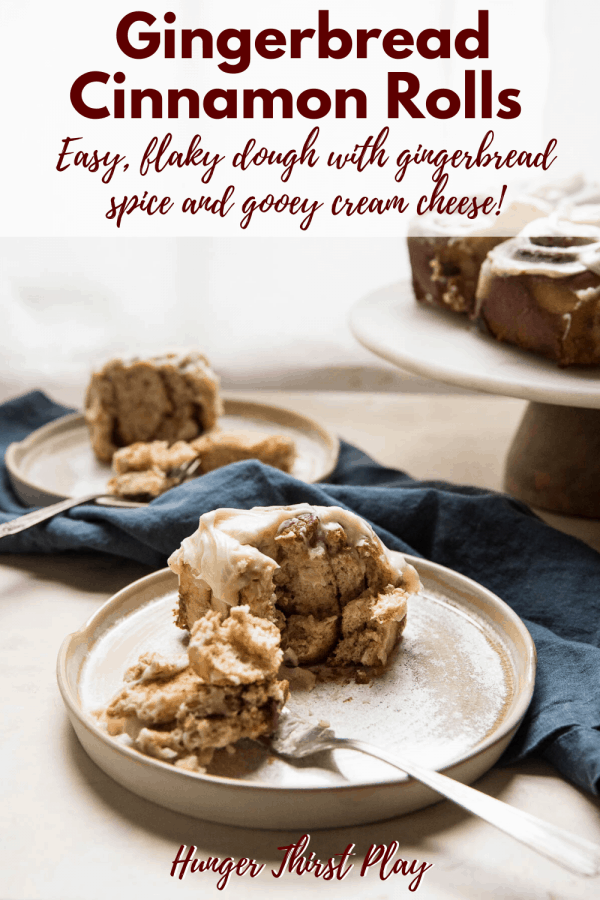 gingerbread cinnamon rolls on plates with forks
