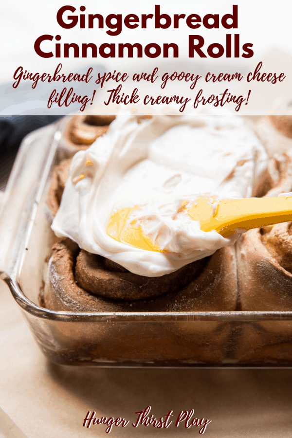 frosting spreading on cinnamon rolls in a pan