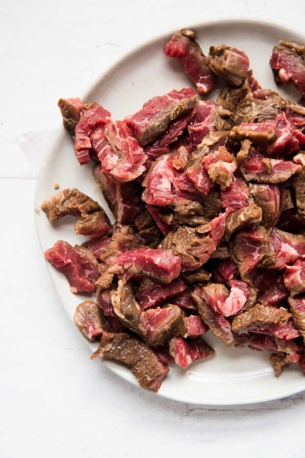 marinated carne asada meat sliced and ready for grilling