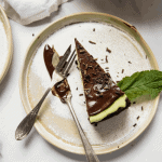 Slice of cheesecake with mint