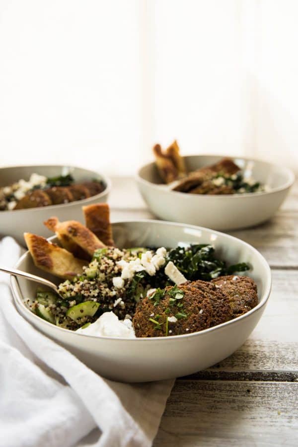 side angle of falafel quinoa bowls stuffed with ingredients