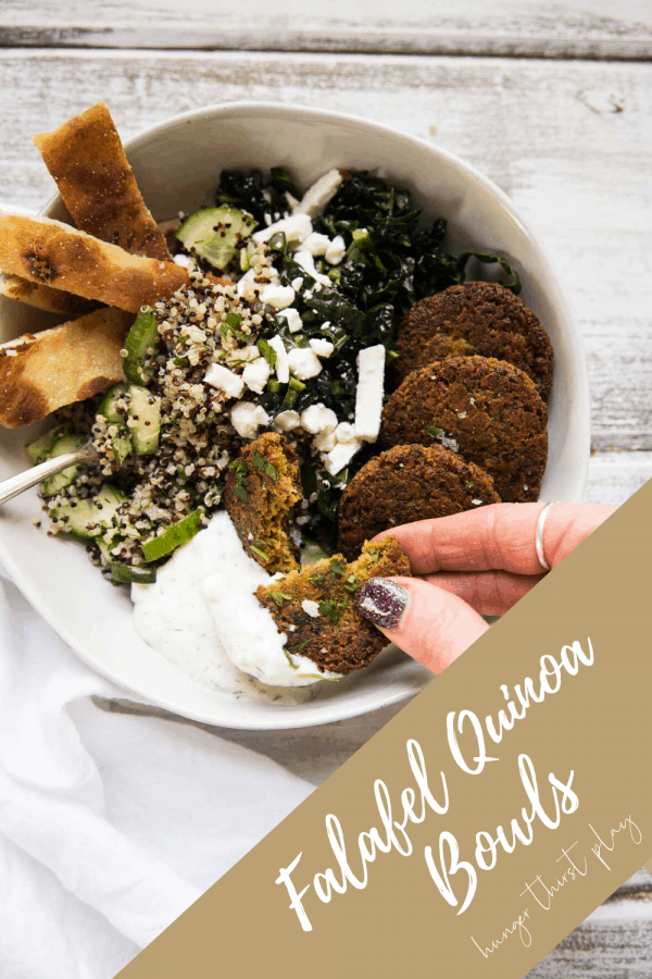 scooping tzatziki with a piece of falafel