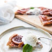 slice of blood orange tart with scoop of vanilla ice cream