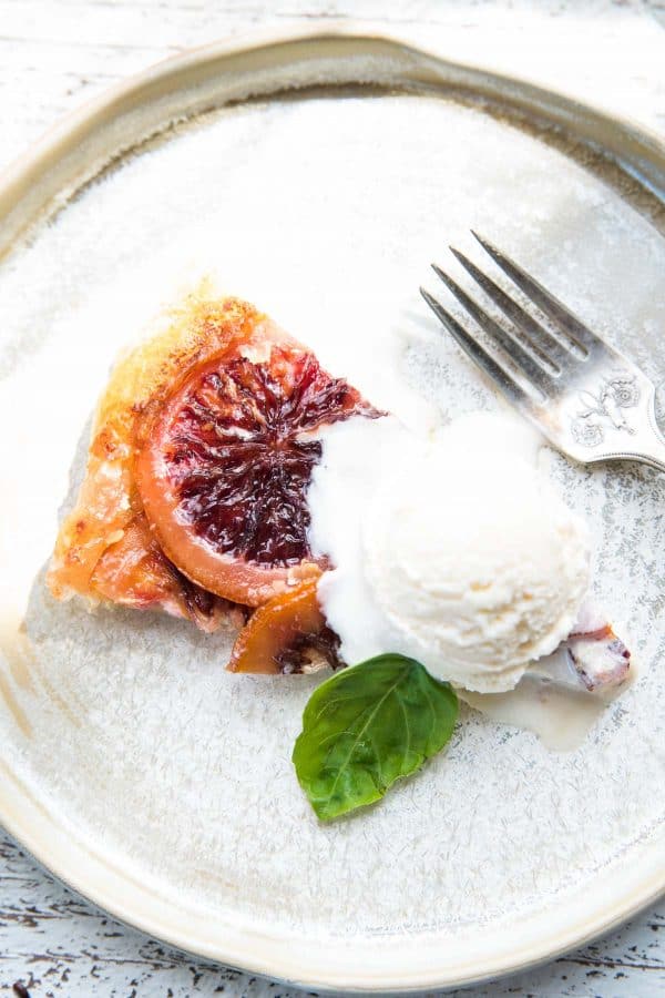 close of up blood orange mascarpone tart with vanilla ice cream